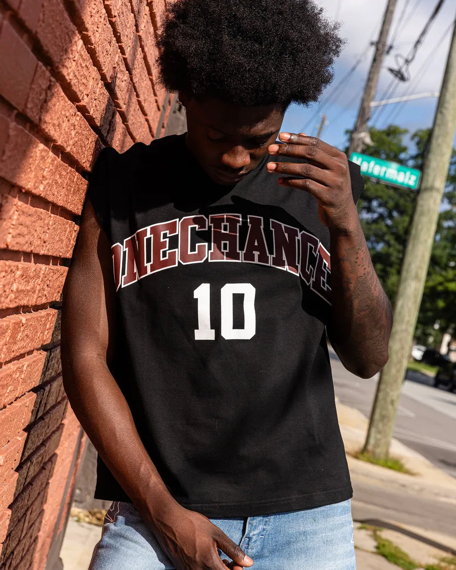 Model wearing a black OneChance number 10 sports jersey